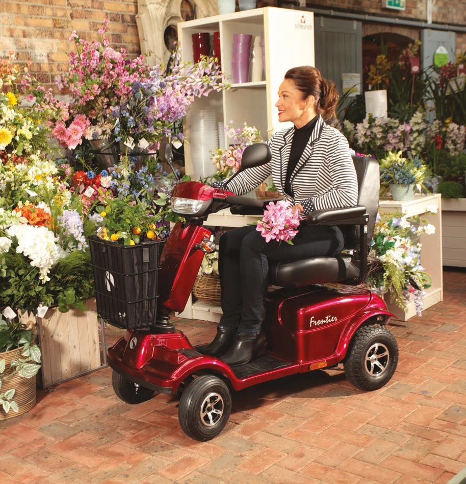 Electric Mobility Rascal Frontier Mobility Scooter in red in a flower shop