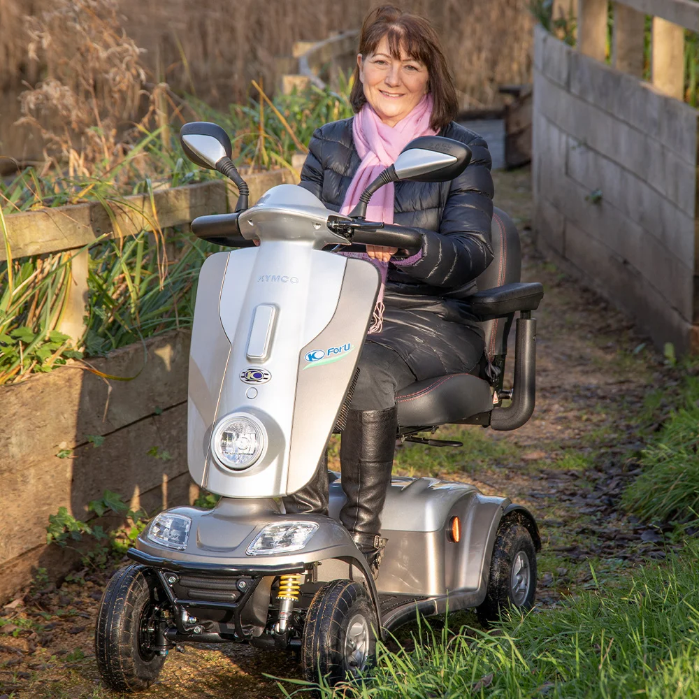 Kymco Midi XLS Mobility Scooter being driven on rough muddy ground