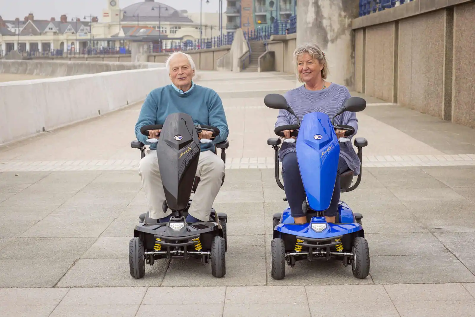 Couple on their Kymco Komfy 8 enjoying the fresh air