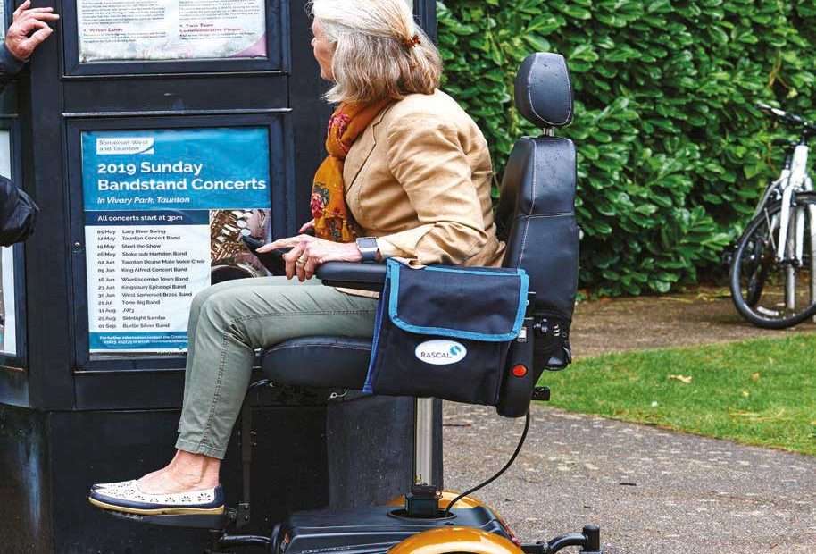 Electric Mobility Ryley Seat Lift Powerchair being used in the park