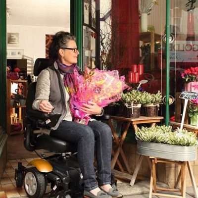 Electric Mobility Rascal Ryley Powerchair being used while a women goes shopping