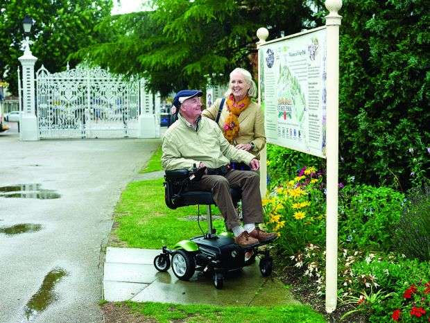 Electric Mobility Ryley Seat Lift Powerchair being used outdoors