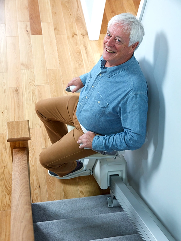 Man on a stairlift with zero intrusion