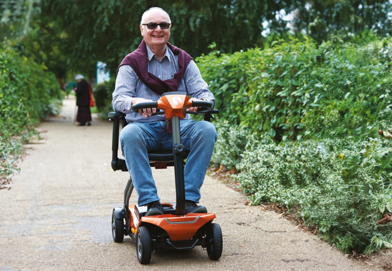 Elderly gentleman riding folding mobility scooters for summer lightweight