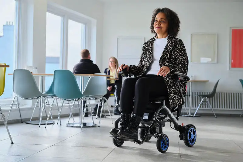 Disabled Holiday Maker on power chair at airport