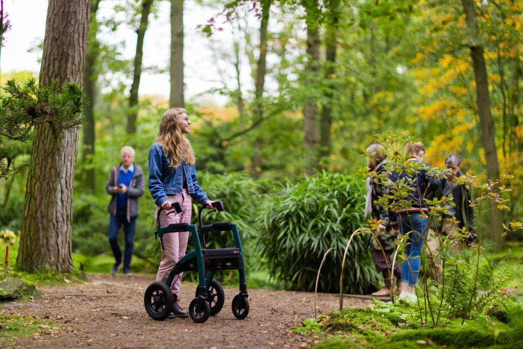 rollator user on forest walk